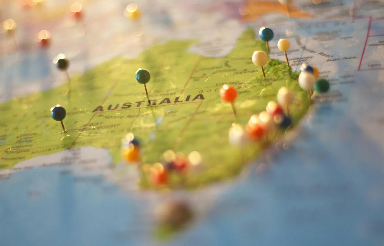 Map of Australia with colorful pushpins marking locations.