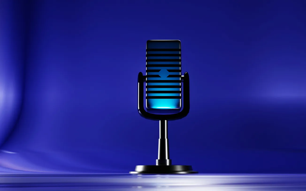 Vintage microphone glows with a blue light against a smooth, deep blue background, evoking a classic, elegant, and futuristic atmosphere.